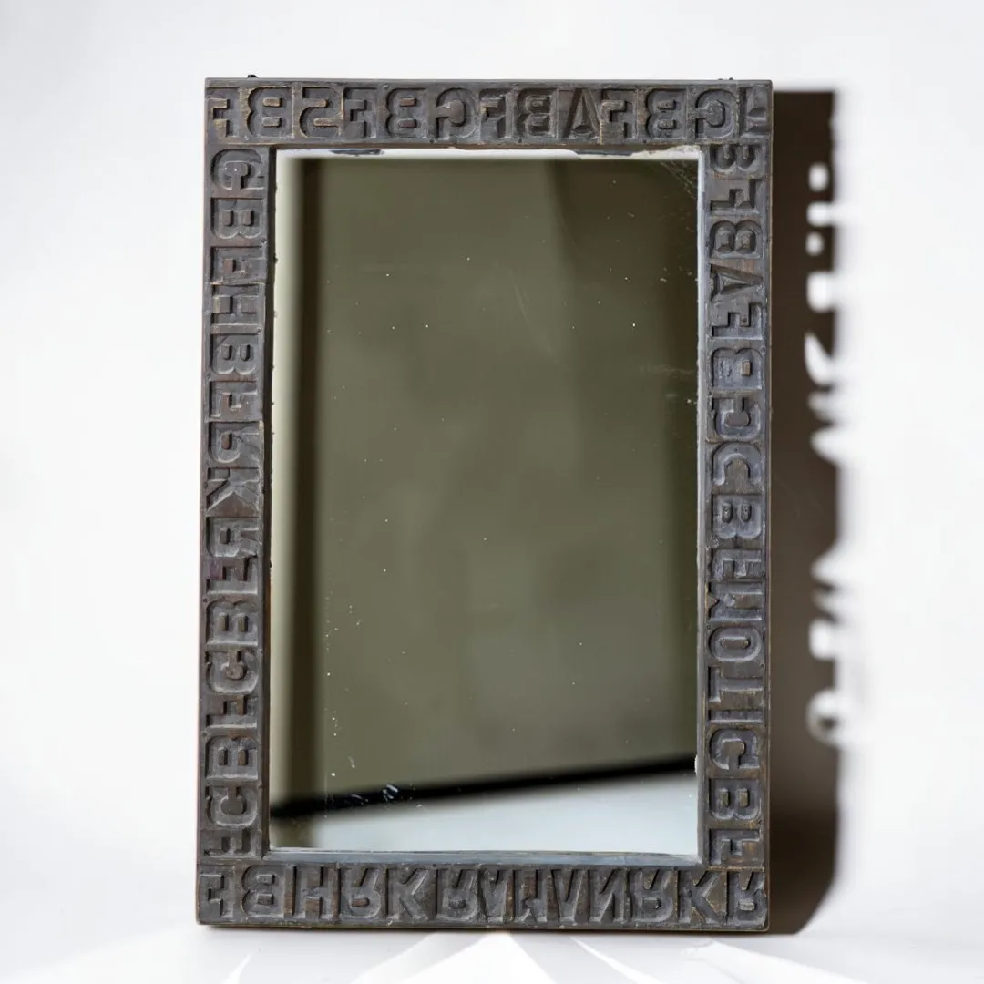 The Relief Typographic Mirror